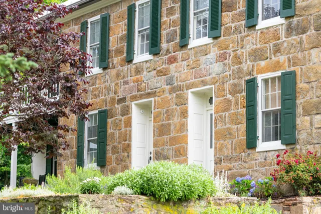 a bathroom with a granite countertop sink a shower and a bathtub