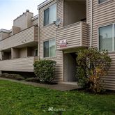 a view of a house with a yard and plants