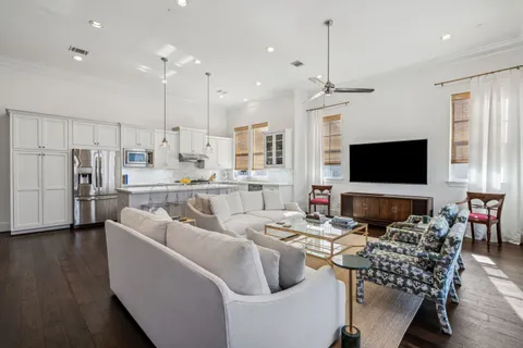 a living room with lots of furniture and a flat screen tv
