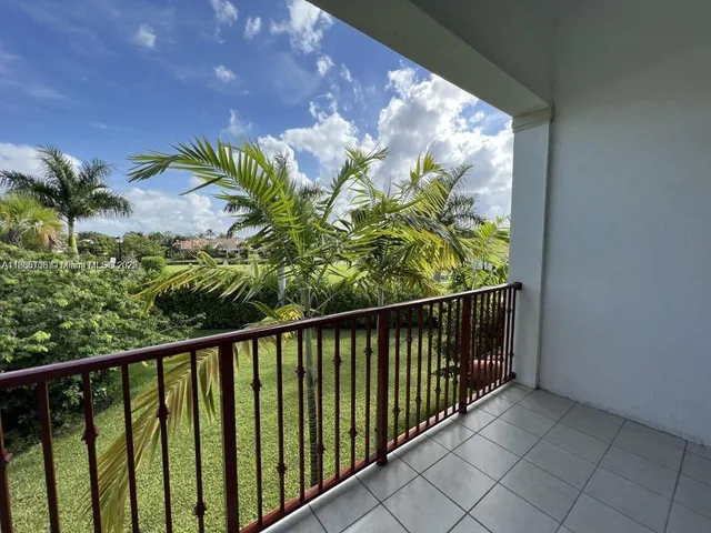 a view of a balcony with plants