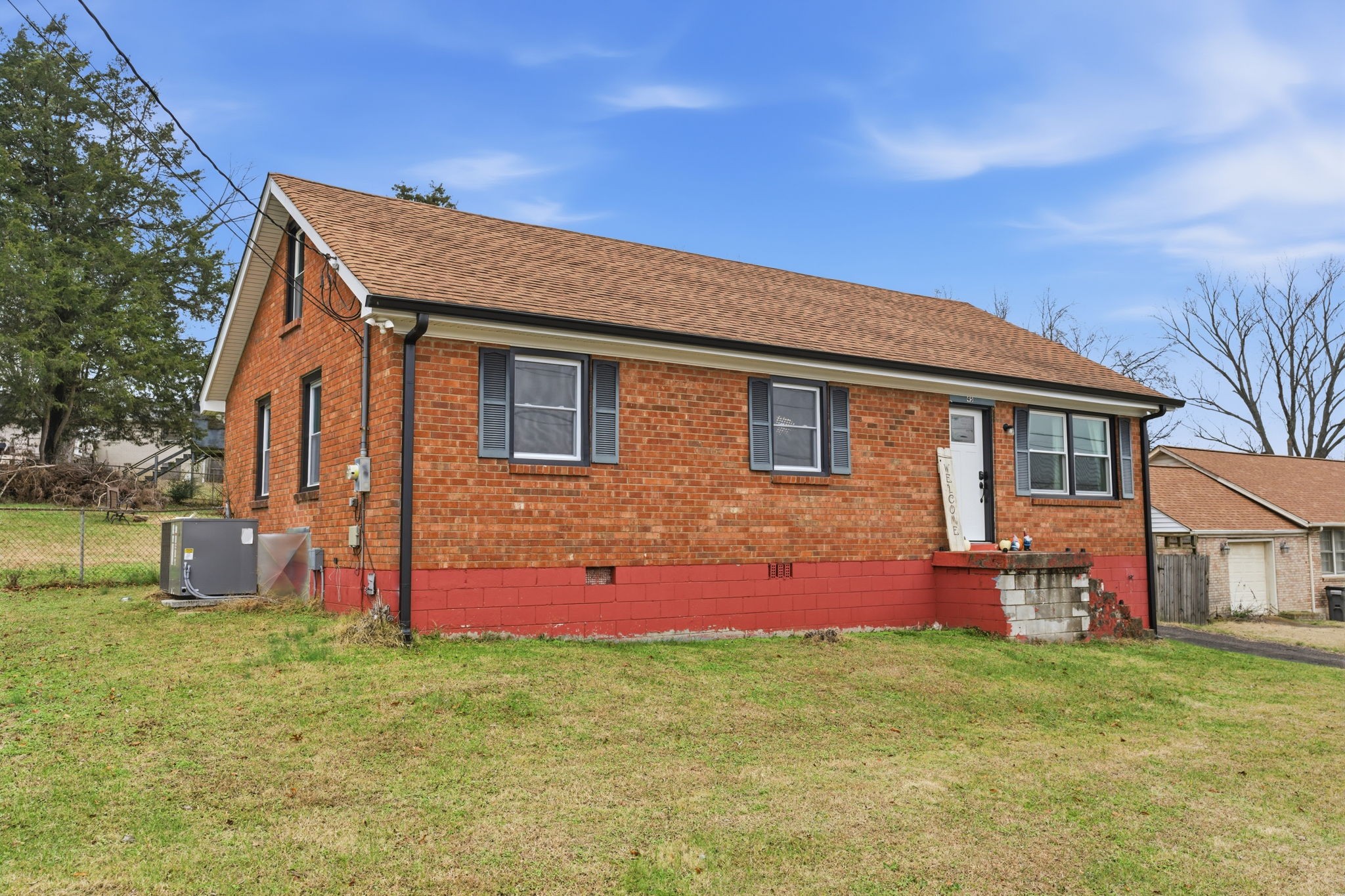 front view of a house with a yard