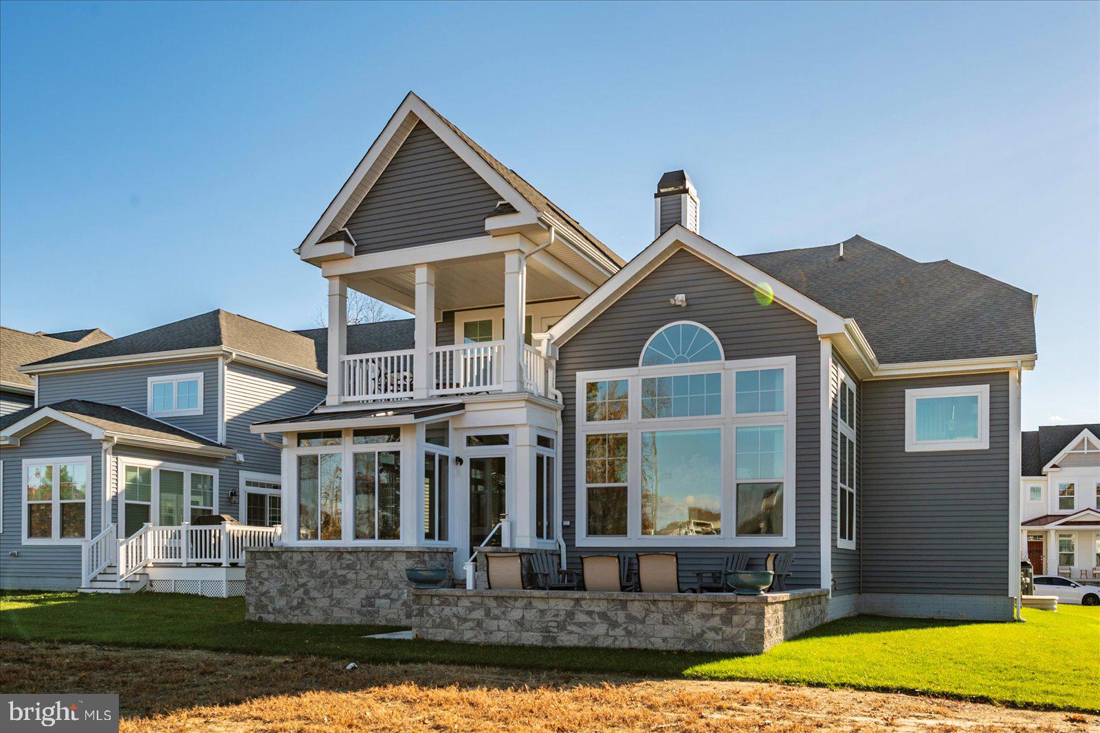 19218 American Holly Road Rehoboth Beach, DE 19971 - Photo 103 of 107 a front view of a house with a yard