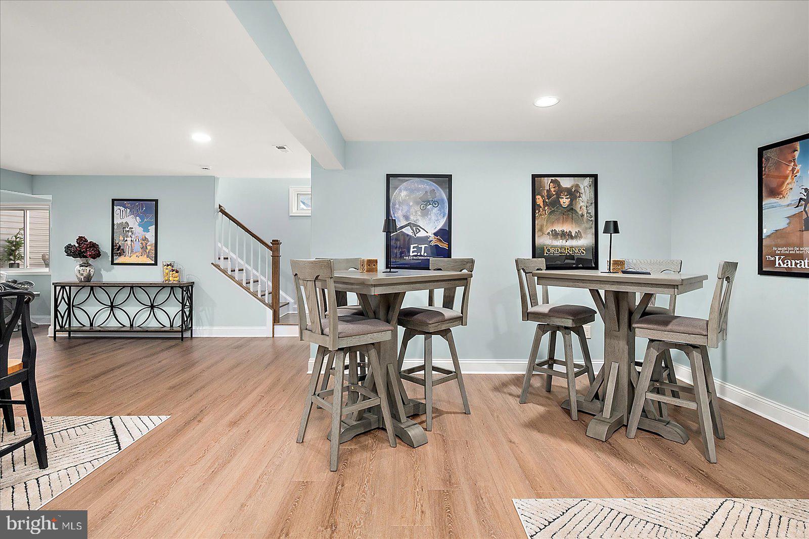 19218 American Holly Road Rehoboth Beach, DE 19971 - Photo 70 of 107 a view of a dining room with furniture and wooden floor