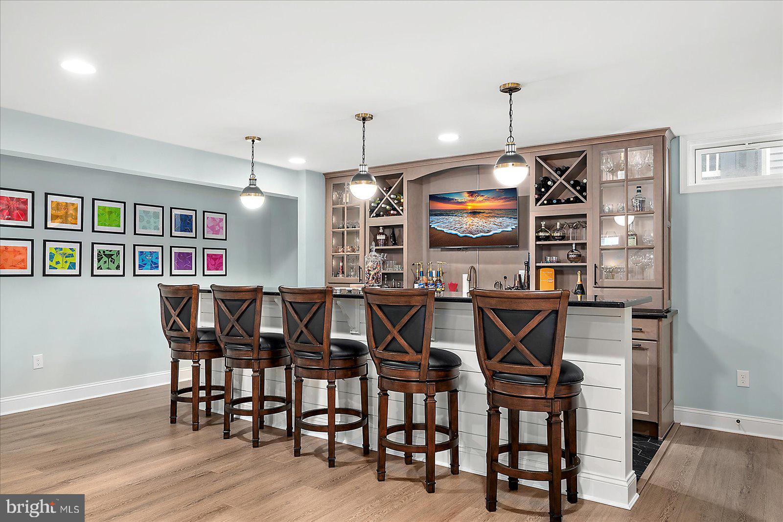 19218 American Holly Road Rehoboth Beach, DE 19971 - Photo 75 of 107 a view of a dining room with furniture and wooden floor