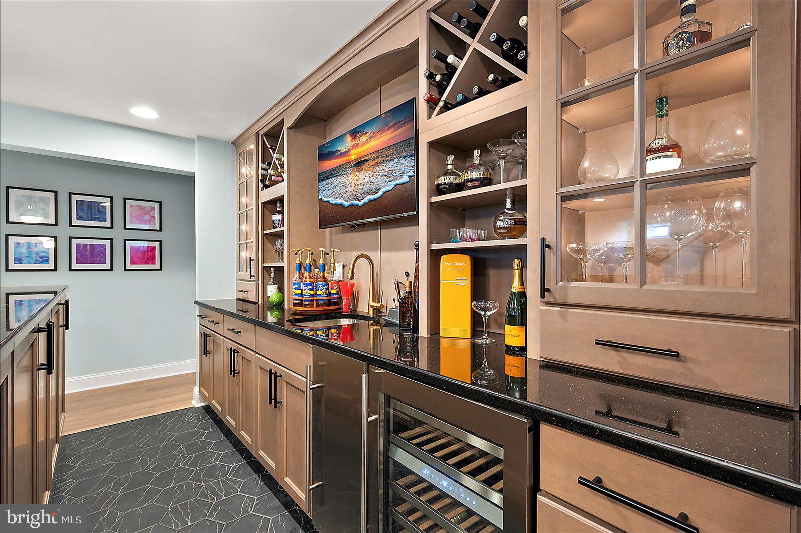 19218 American Holly Road Rehoboth Beach, DE 19971 - Photo 76 of 107 a kitchen with stainless steel appliances a sink and a cabinets