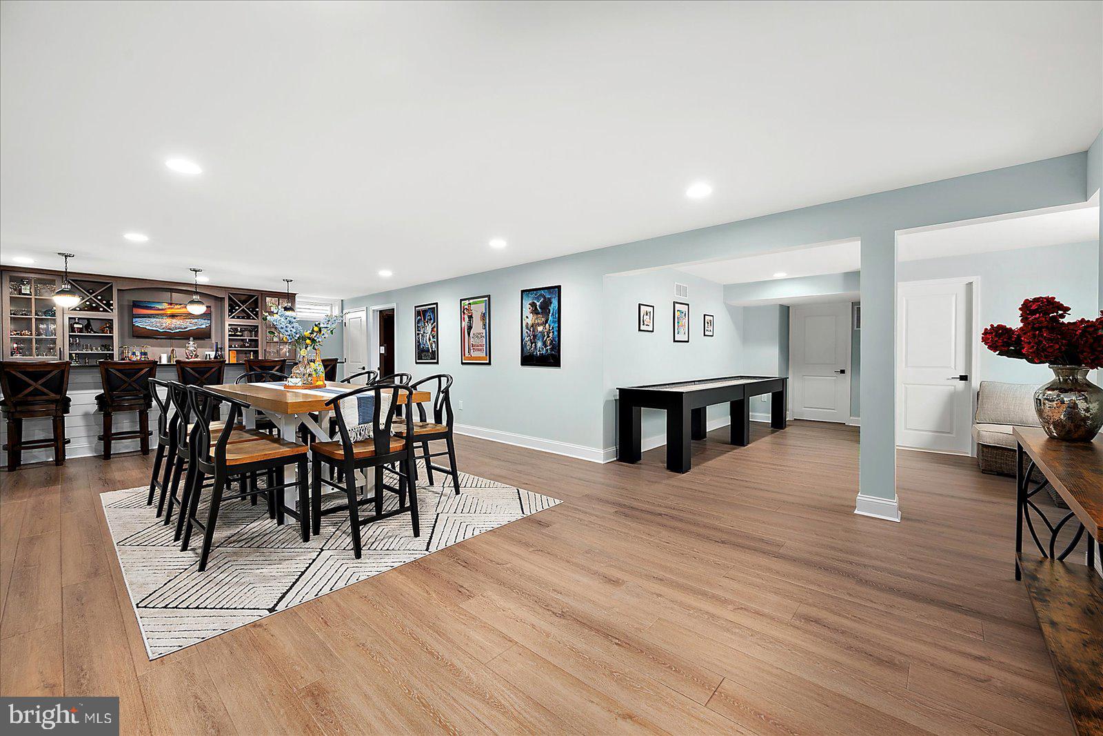 19218 American Holly Road Rehoboth Beach, DE 19971 - Photo 79 of 107 a view of a dining room with furniture and wooden floor