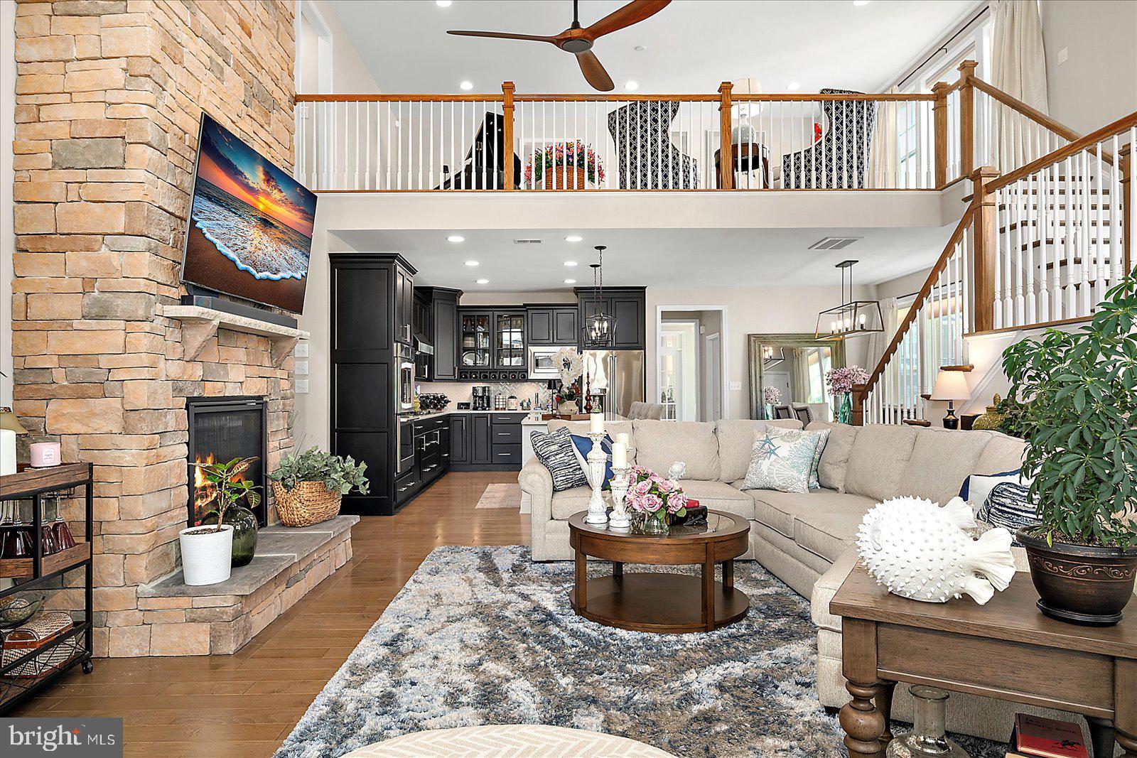 19218 American Holly Road Rehoboth Beach, DE 19971 - Photo 104 of 107 a living room with furniture or couch and a potted plant