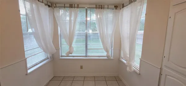 a view of a window in an empty room