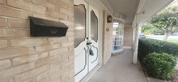 a bathroom with a shower and a sink