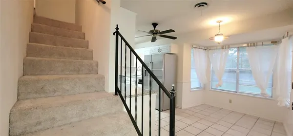 a view of entryway and hall with a window