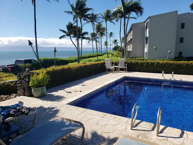 a view of a chairs and table in the patio