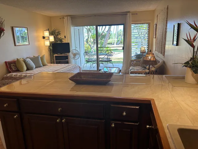 a kitchen with a sink and large window