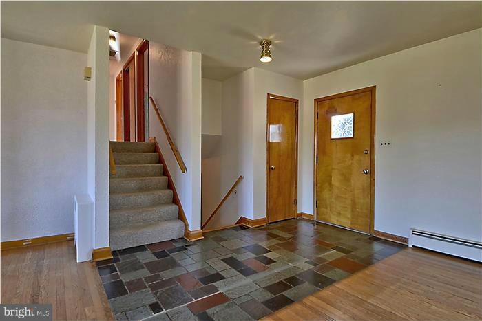 805 Crest Hill Road Severn, MD 21061 - Photo 9 of 20 Slate entry, stairs leading to the bedroom level.
