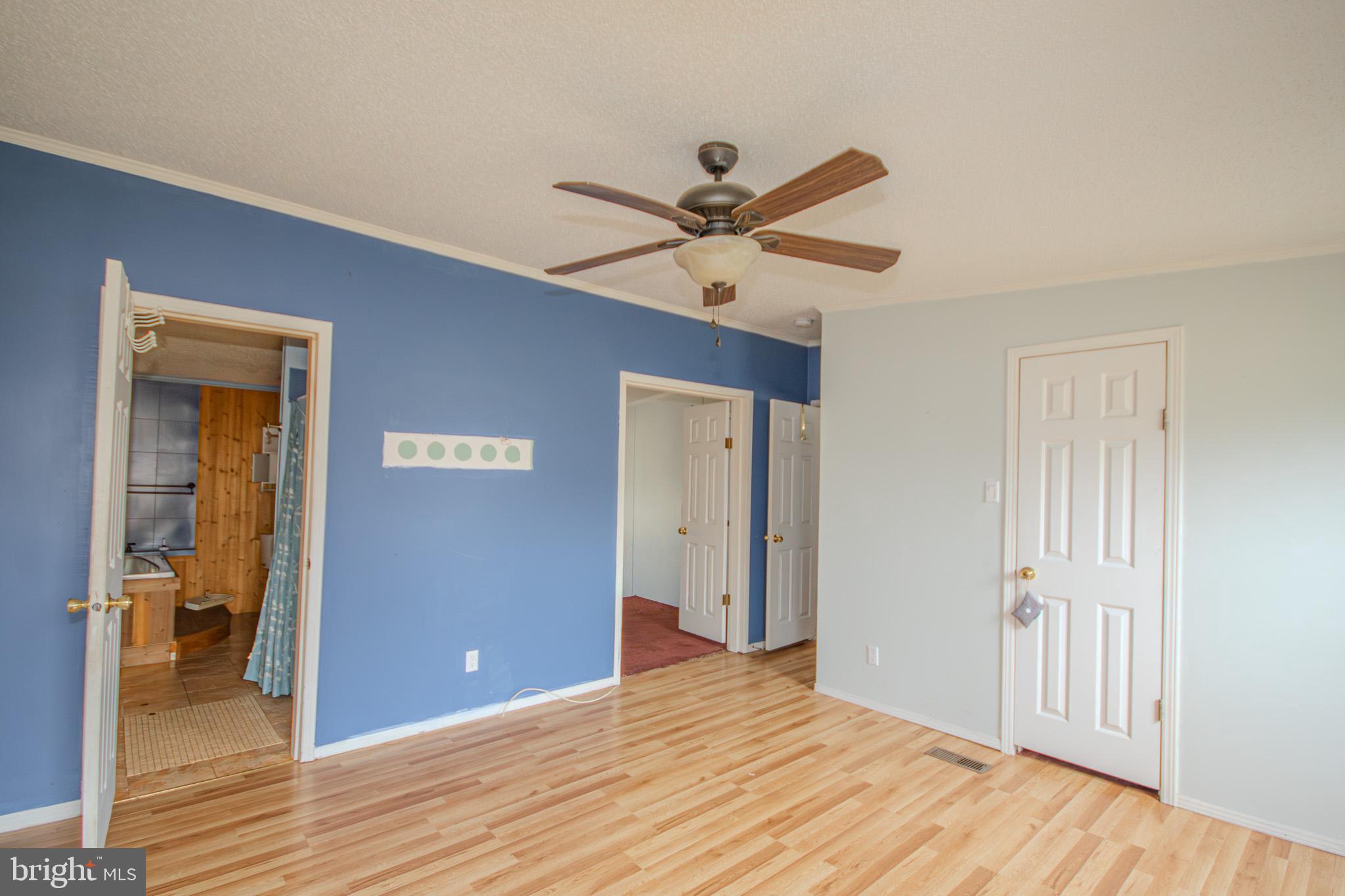 3887 Texas Road Bivalve, MD 21814 - Photo 17 of 34 a view of a livingroom with a chandelier fan