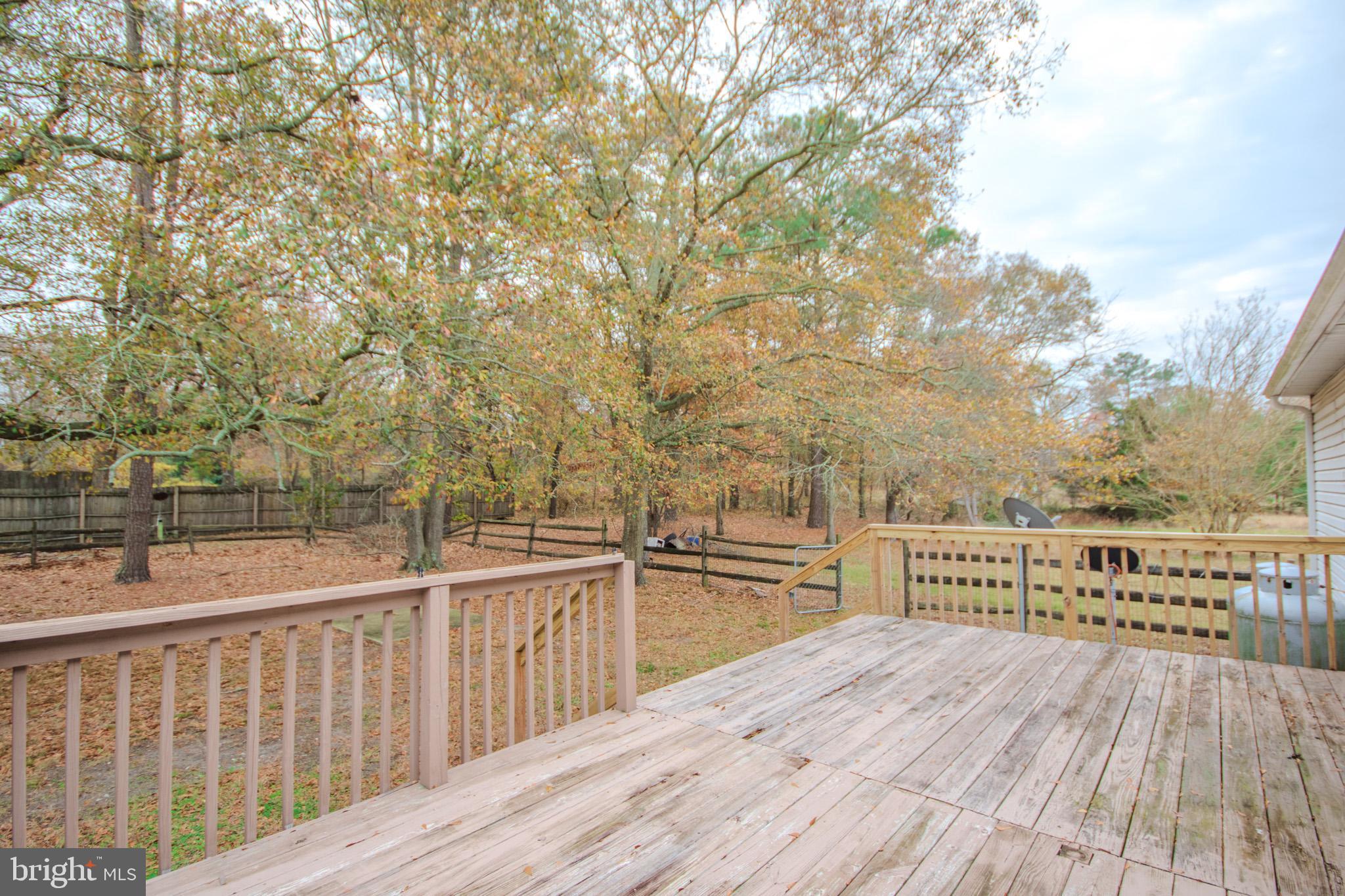 3887 Texas Road Bivalve, MD 21814 - Photo 28 of 34 a view of balcony with wooden floor and fence