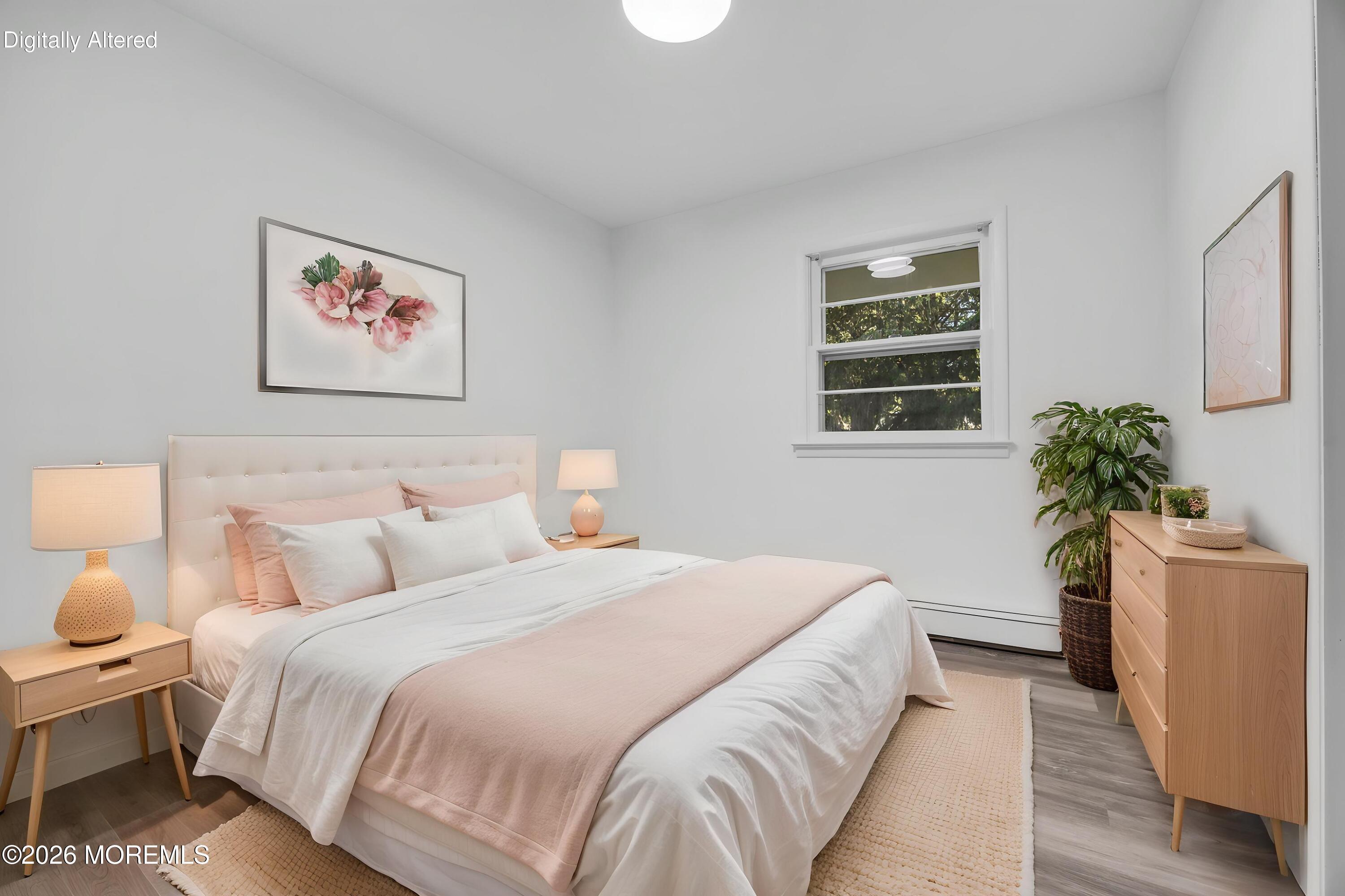 416 Oak Tree Road Freehold, NJ 07728 - Photo 10 of 46 a bedroom with a bed and a potted plant