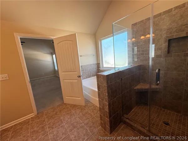 a bathroom with a glass door shower