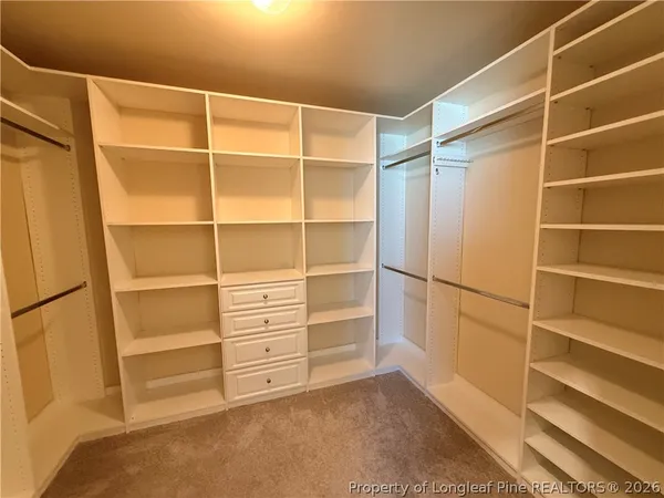 a view of an empty walk in closet