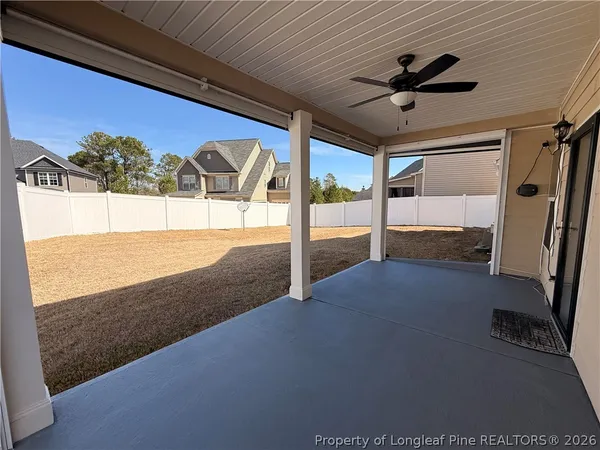 a view of a ceiling fan and window