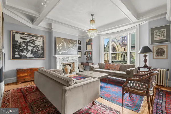 a dining room with furniture a rug and wooden floor