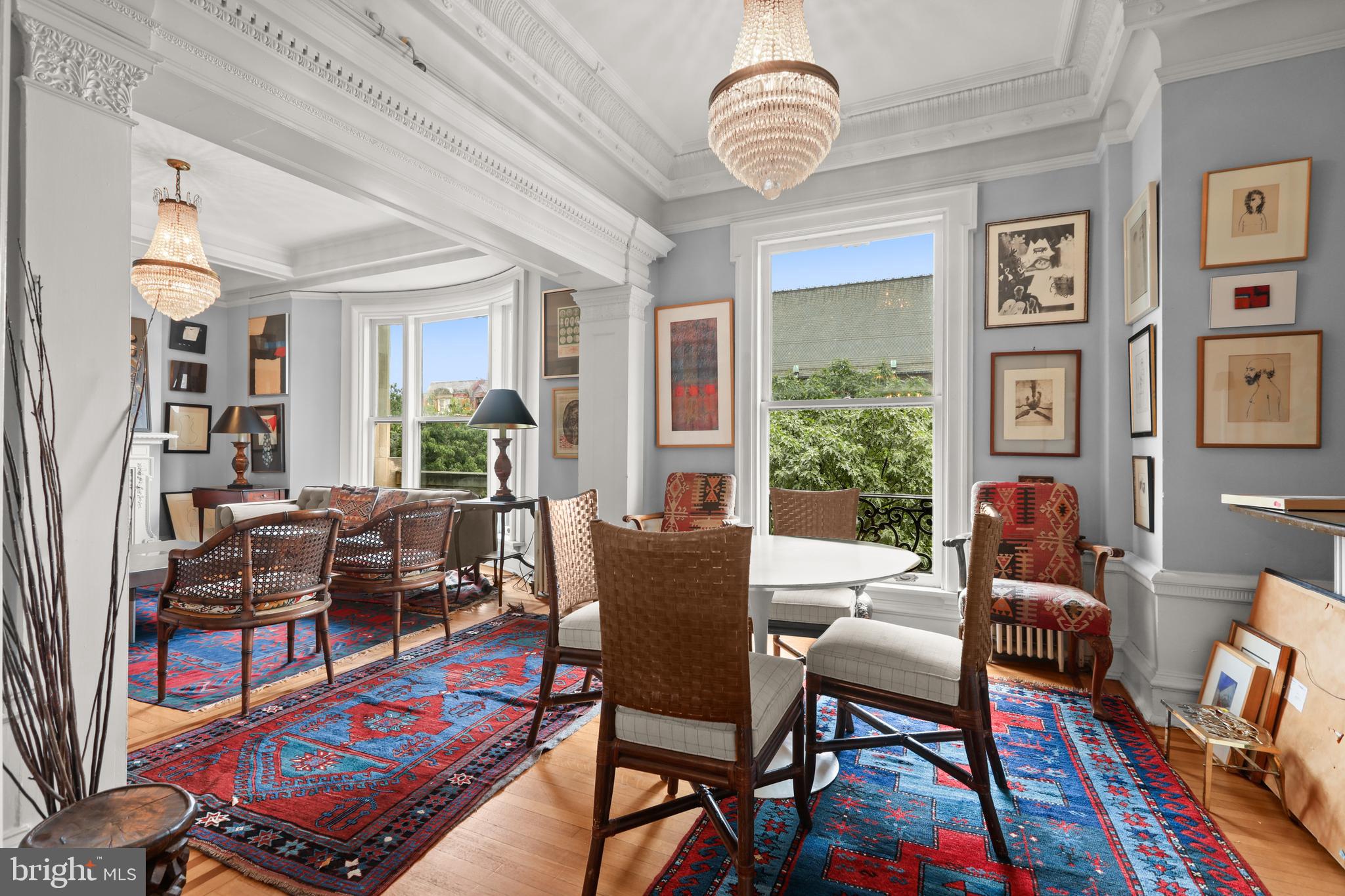 700 Washington Place, Unit 3B Baltimore, MD 21201 - Photo 14 of 43 a dining room with furniture a rug and wooden floor