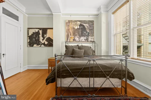 a view of walk in closet with living room