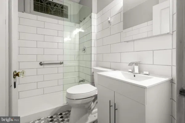 a bedroom with furniture and a chandelier