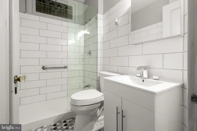 a bedroom with furniture and a chandelier