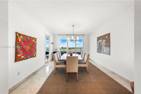 a large white kitchen with a large window