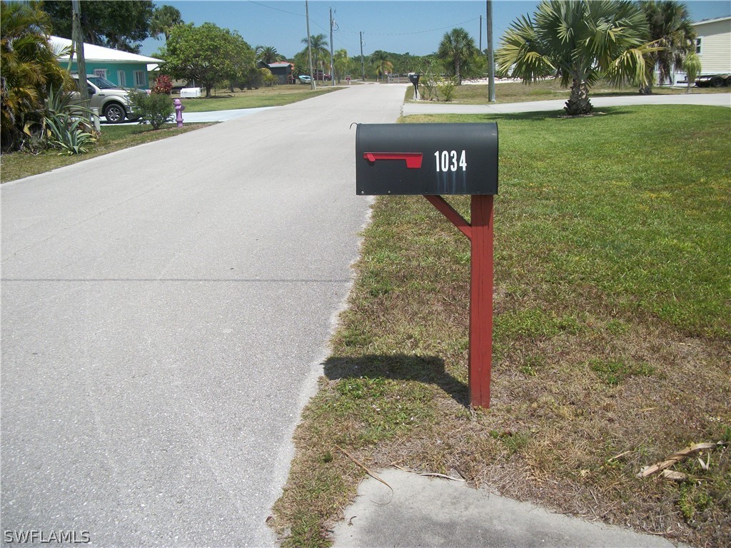 a sign board with street view