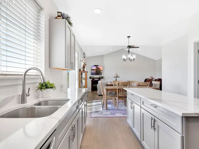 a kitchen with a sink stove and cabinets