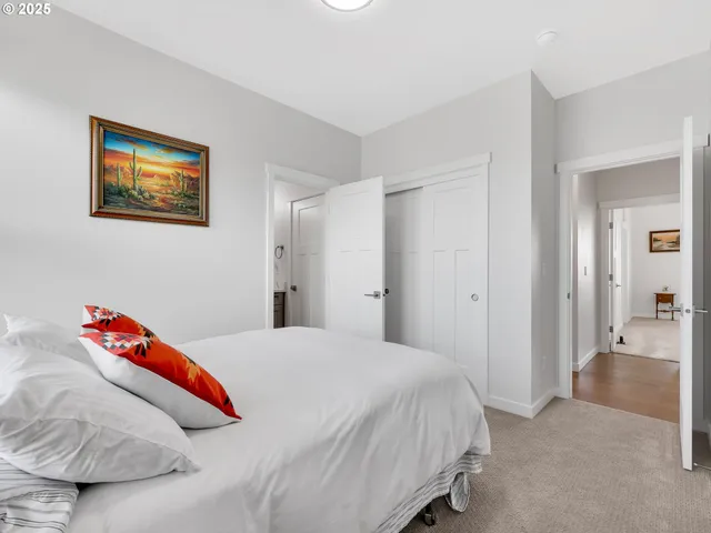 a bedroom with a bed and a couch