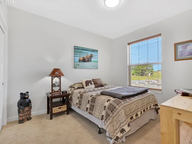 a bedroom with a bed and a table