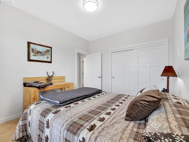 a bedroom with a bed and a lamp