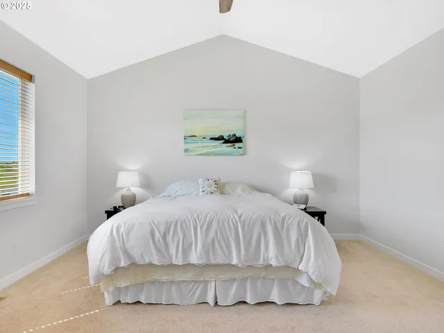 a bedroom with a bed and a night stand