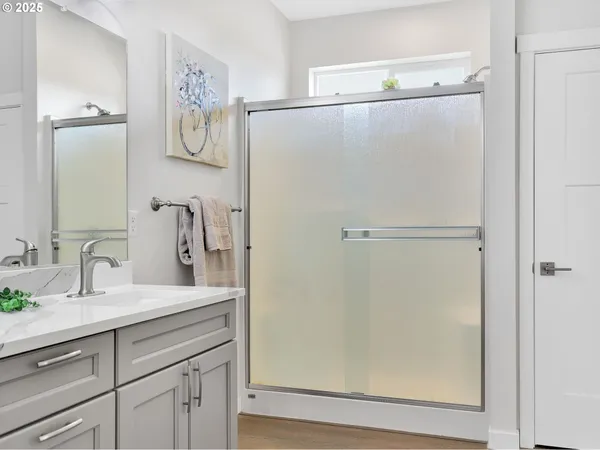 a bathroom with a granite countertop sink mirror and vanity