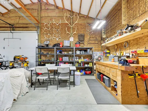a store room with lots of furniture and clutter