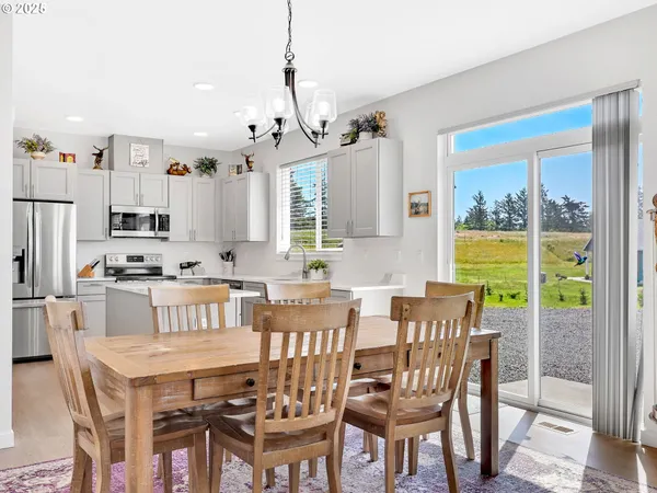 a view of a dining room with furniture window and outside view