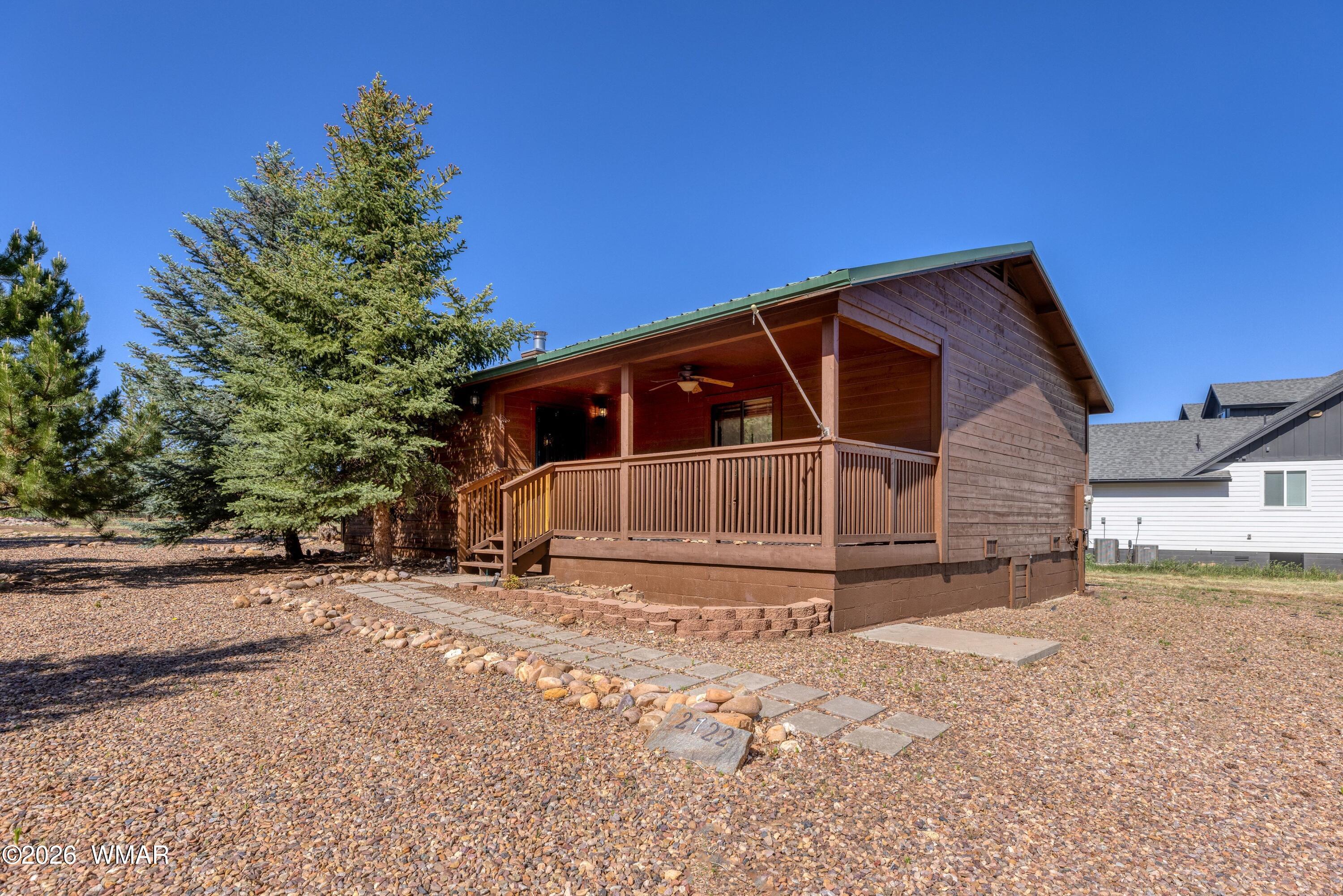 2722 Bain Trail Overgaard, AZ 85933 - Photo 18 of 28 a view of a house with a yard