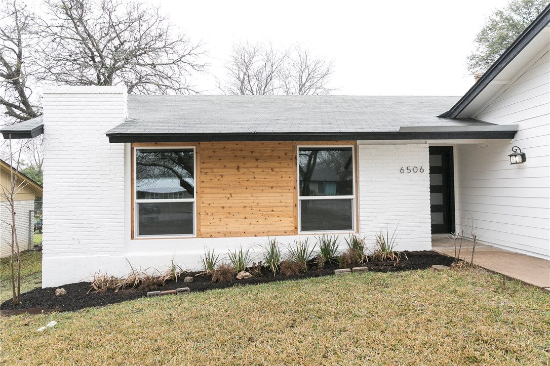 6506 Highpoint Cove Austin, TX 78723 - Photo 1 of 1 a front view of a house with a yard