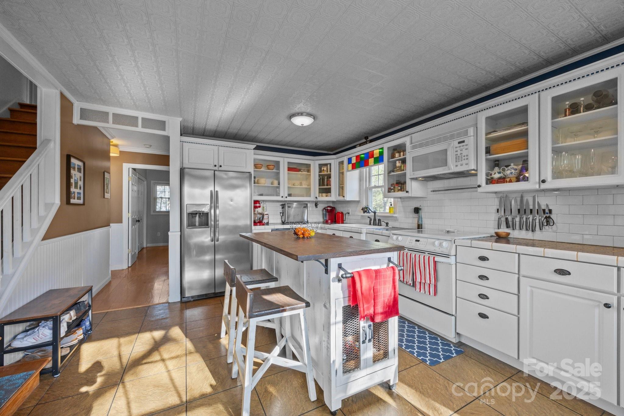 25 Alpine Way Clyde, NC 28721 - Photo 14 of 23 a open kitchen with stainless steel appliances granite countertop a stove and cabinets