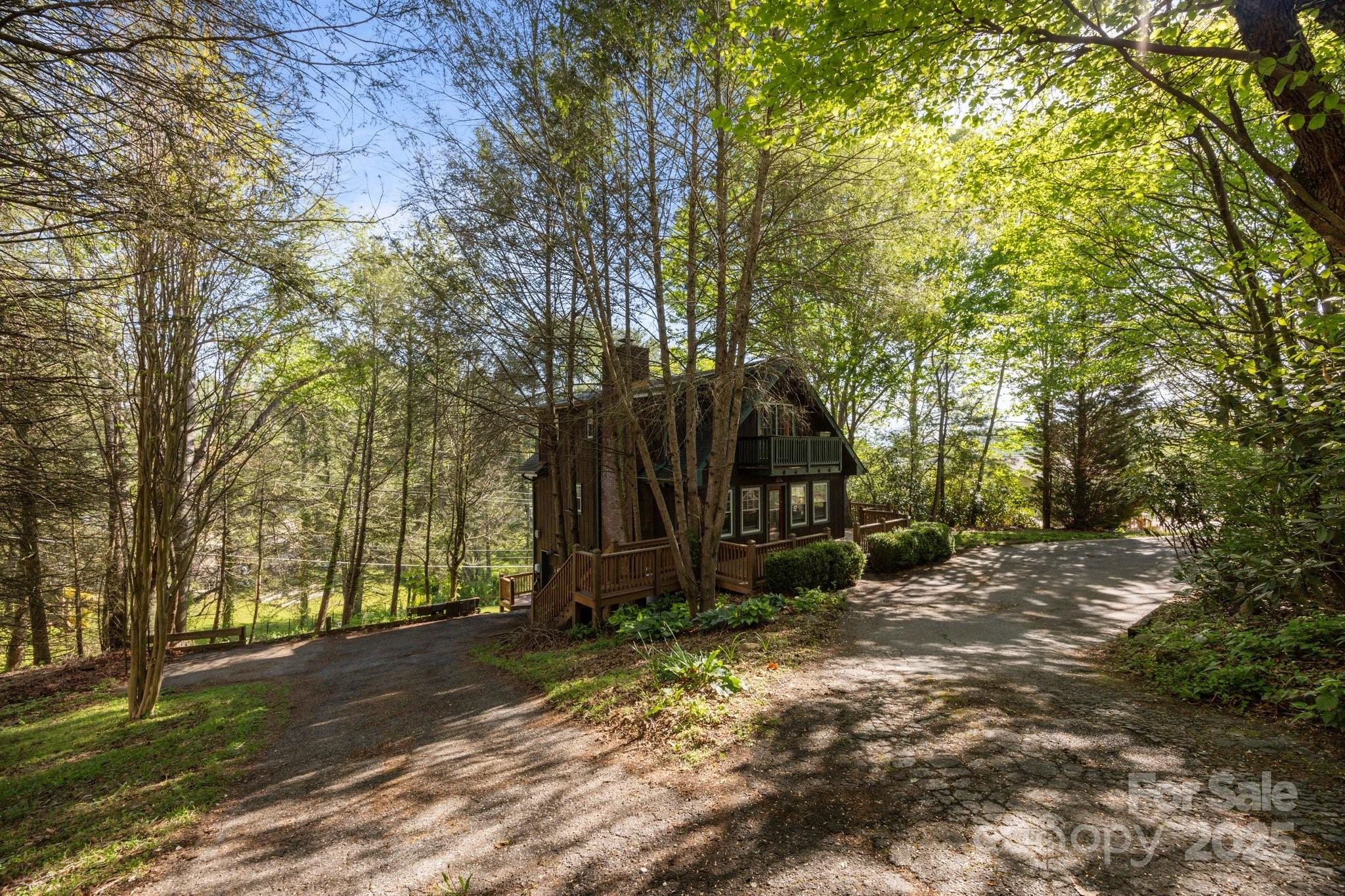 25 Alpine Way Clyde, NC 28721 - Photo 3 of 23 a view of a barn with a large trees