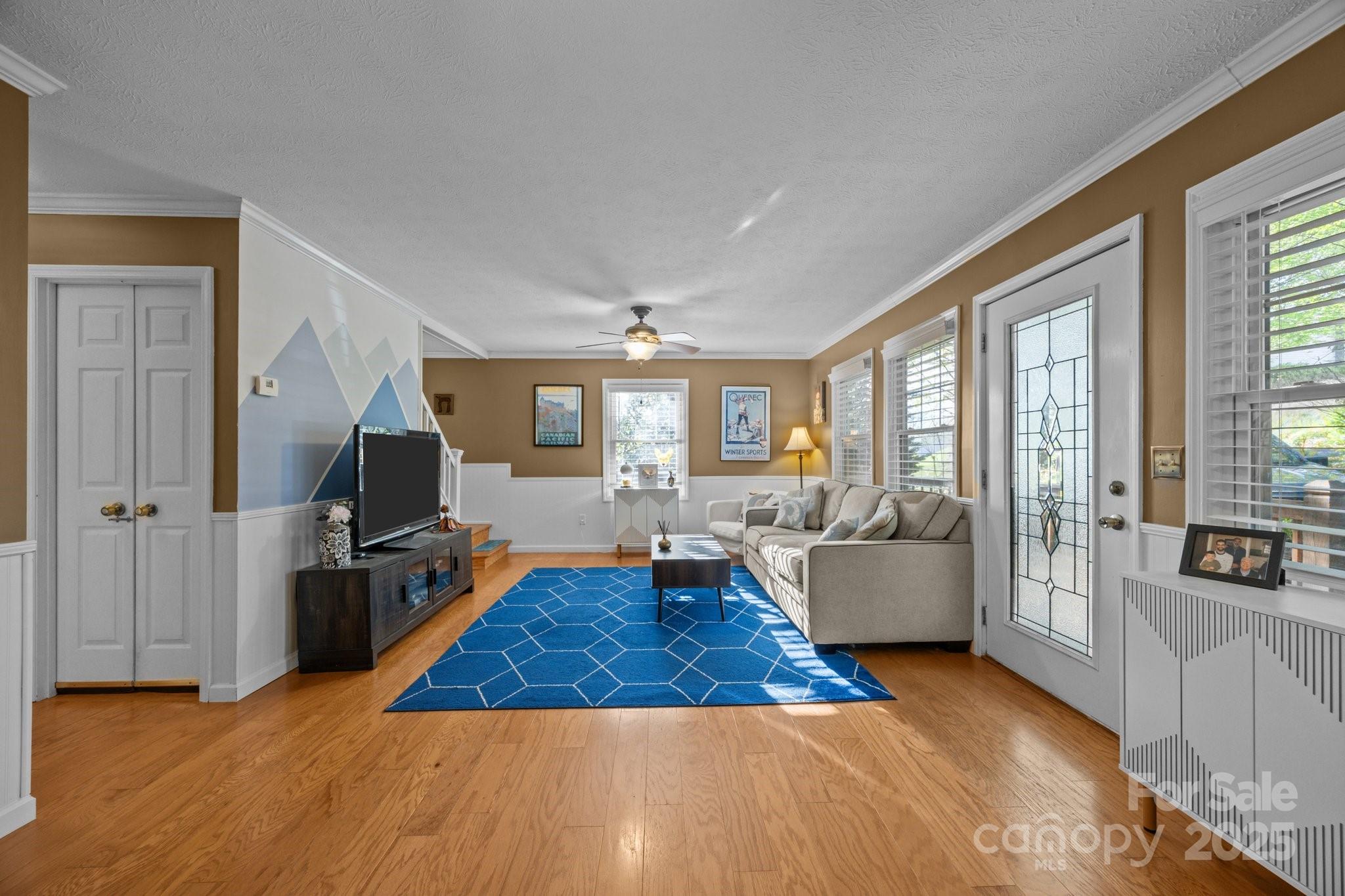 25 Alpine Way Clyde, NC 28721 - Photo 9 of 23 a living room with fireplace furniture and a flat screen tv