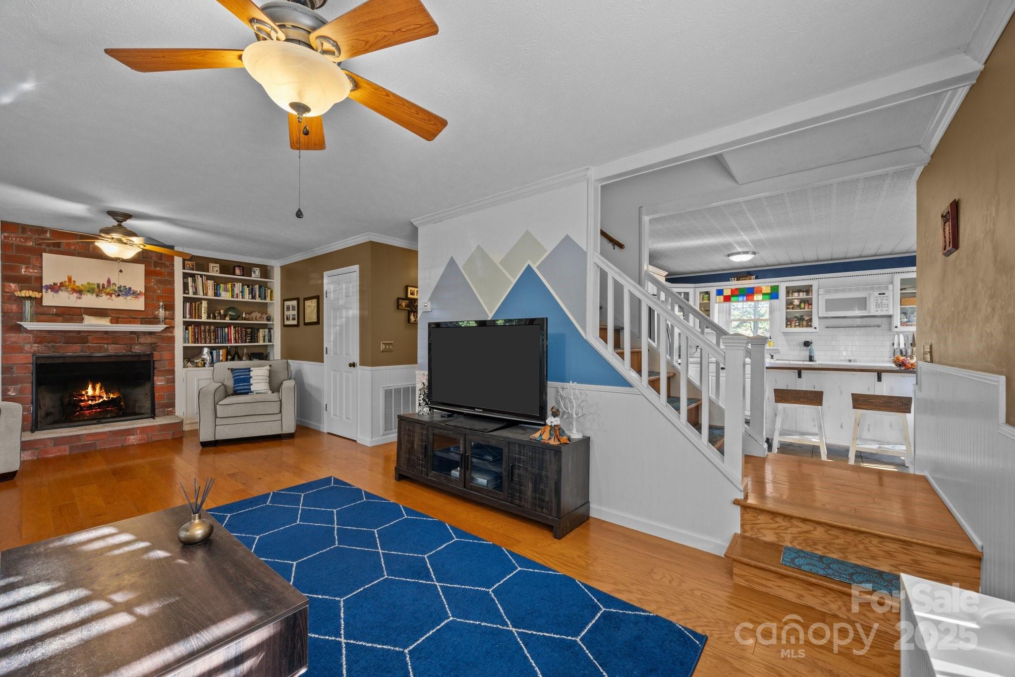 25 Alpine Way Clyde, NC 28721 - Photo 10 of 23 a view of a livingroom with furniture and a fireplace