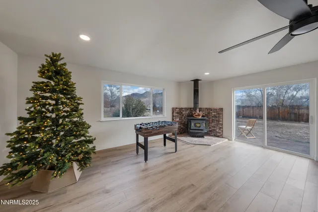 a living room with furniture and a christmas tree