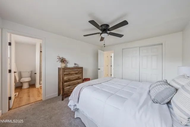 a bedroom with a bed and a view of bathroom
