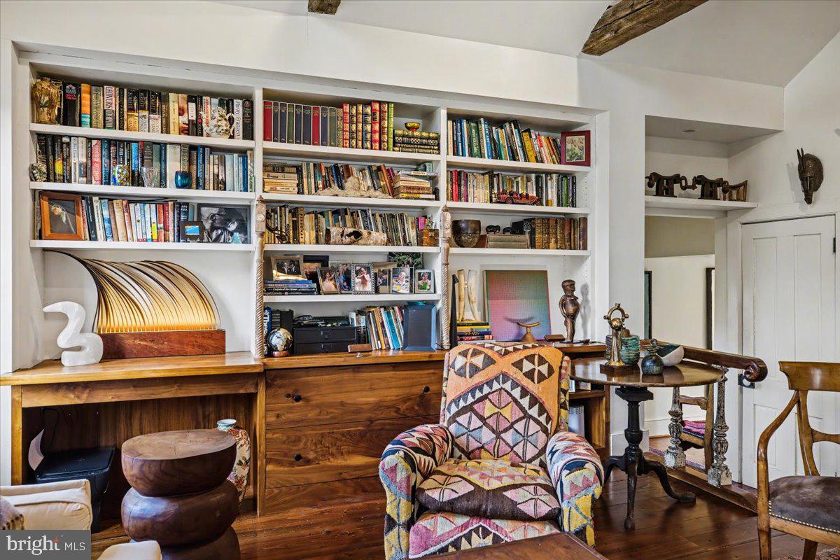 6338 Old Carversville Road Carversville, PA 18913 - Photo 12 of 56 a living room with furniture a book shelf and a book shelf
