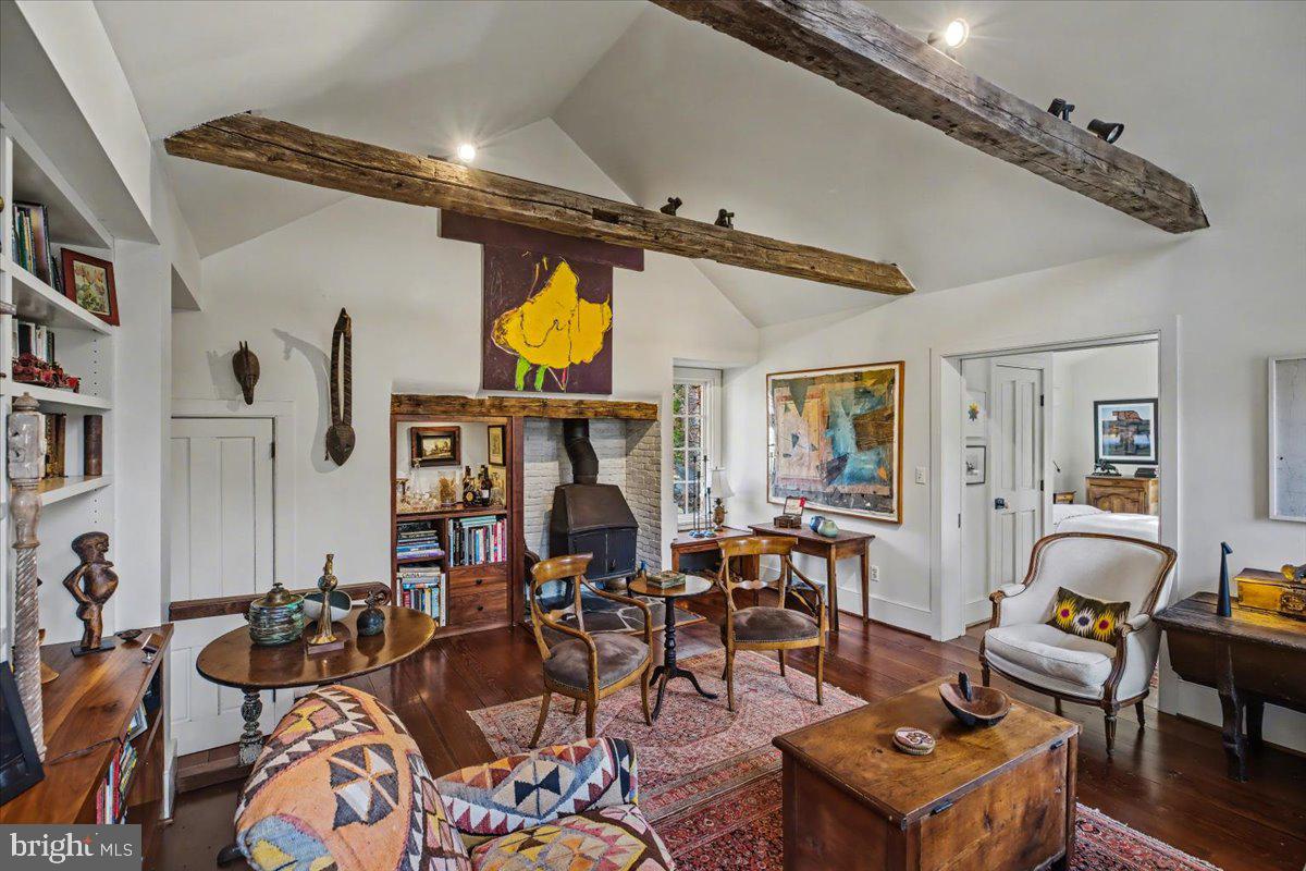 6338 Old Carversville Road Carversville, PA 18913 - Photo 13 of 56 a living room with furniture a rug and white walls