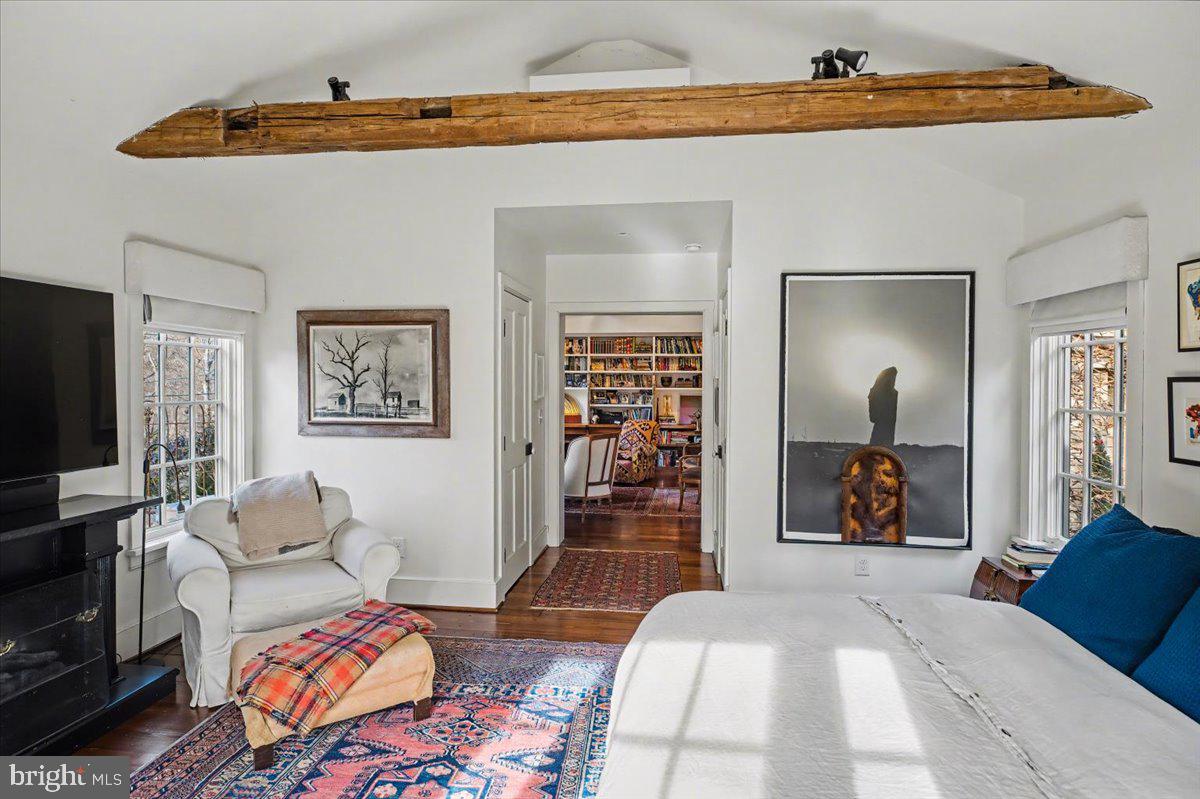 6338 Old Carversville Road Carversville, PA 18913 - Photo 19 of 56 a bedroom with furniture and a flat screen tv