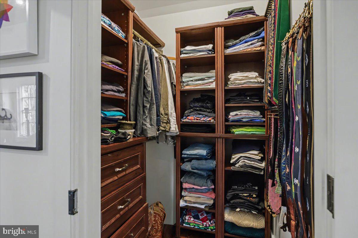 6338 Old Carversville Road Carversville, PA 18913 - Photo 20 of 56 a view of walk in closet with clothes and shoes